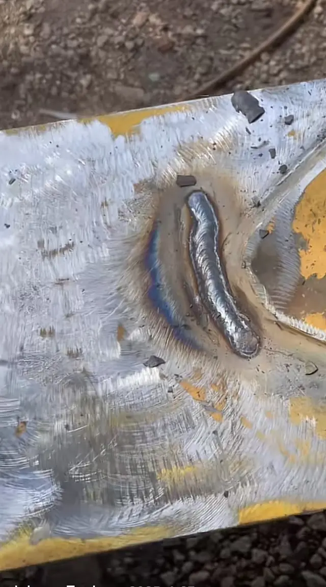 Finished weld repair on a heavy equipment wear plate