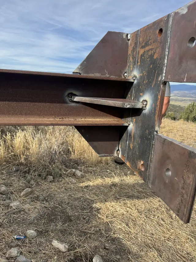 Fabricated bracket plates welded to a steel beam