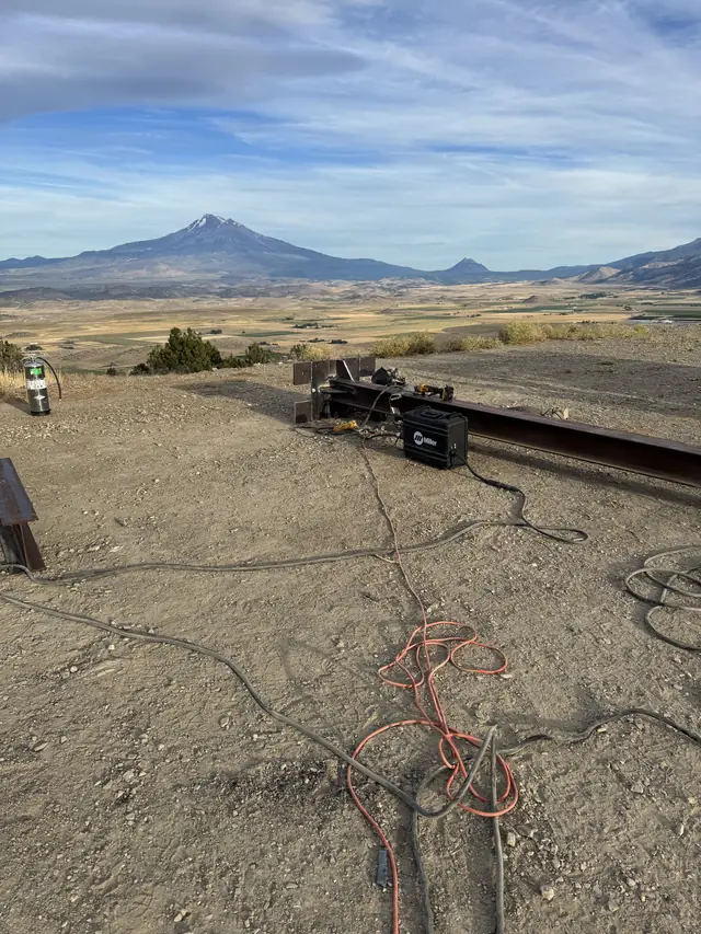 AHT welding rig on open rural ground below Mt. Shasta