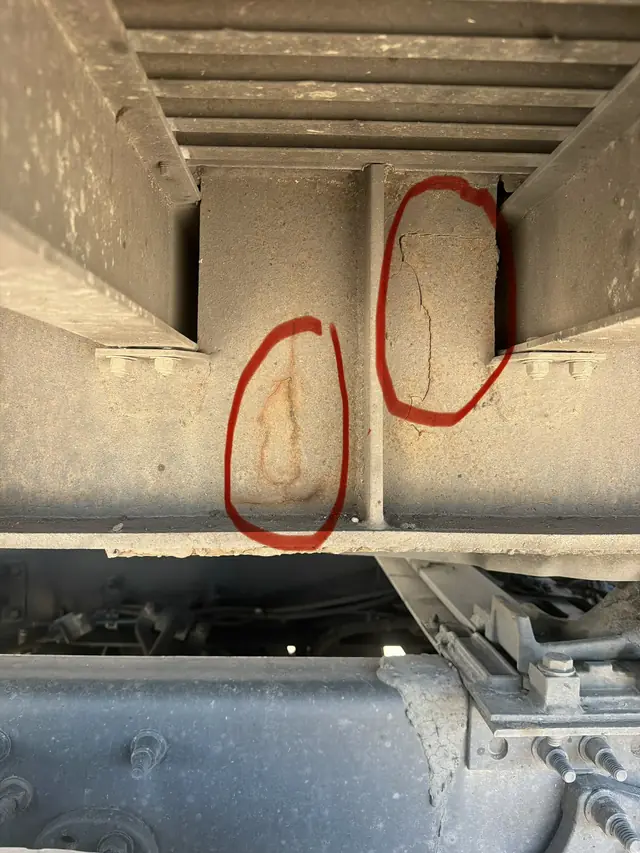 Cracked I-beam joints marked on a semi flatbed in Redding