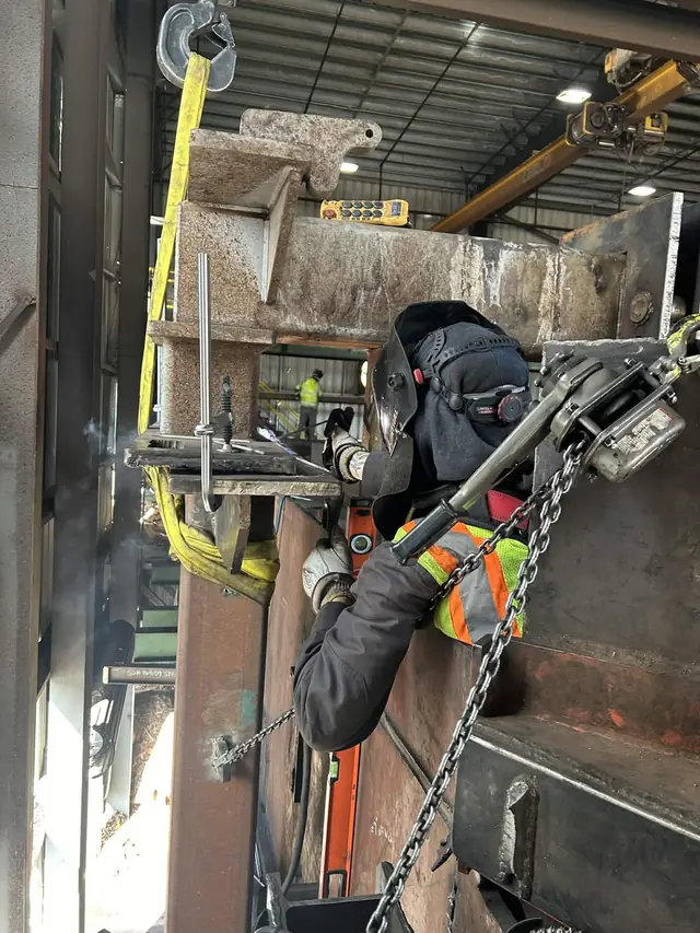 Heavy steel section rigged for fit-up in an industrial plant