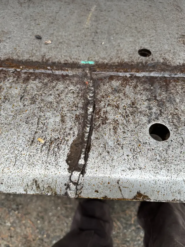 Cracked loader bucket before repair