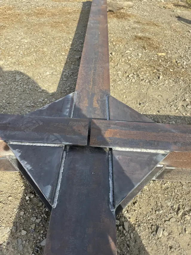 Finished gusset reinforcement welds on a fabricated steel assembly