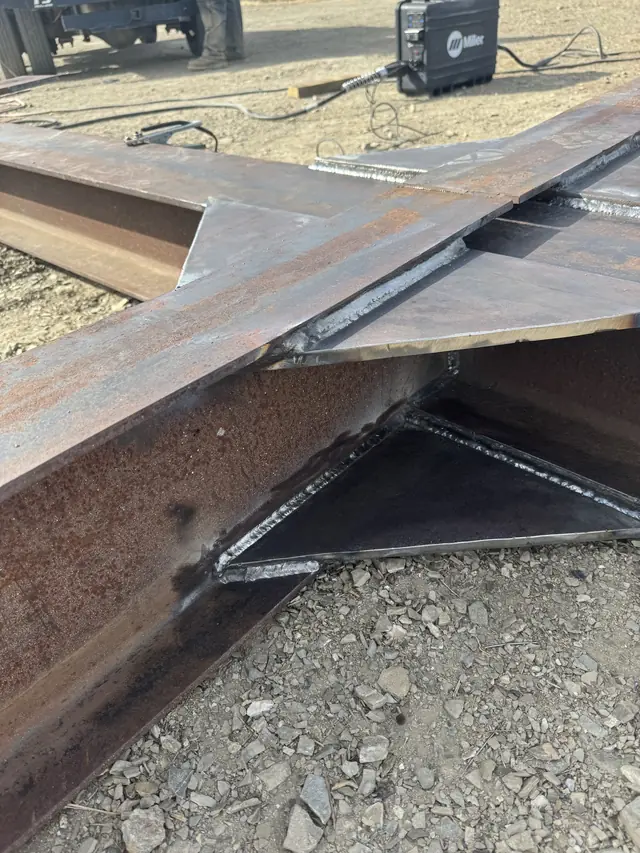 New gusset plates welded into a fabricated steel assembly